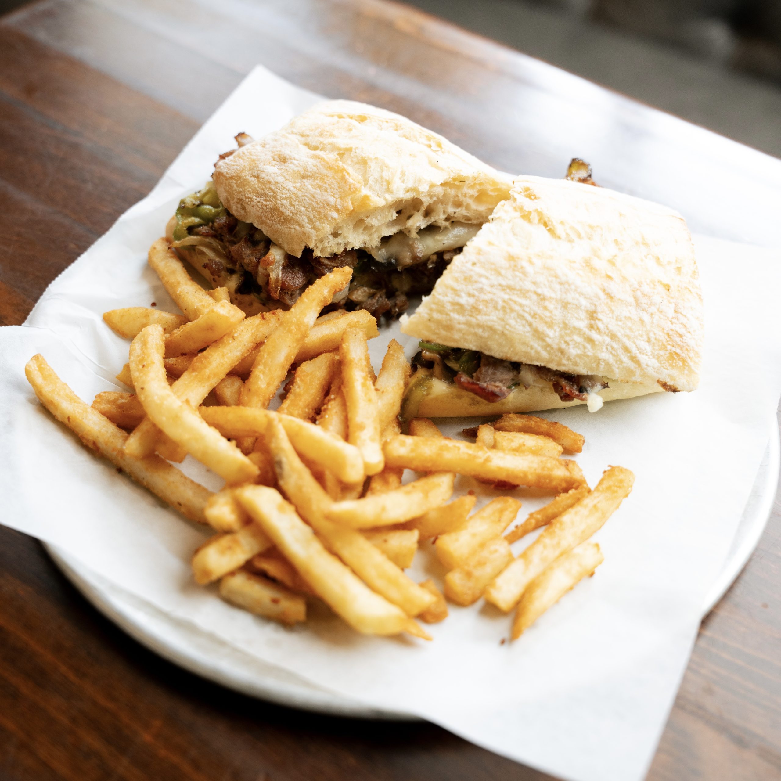 Serving Philly cheesesteak pizza in Mount Pleasant