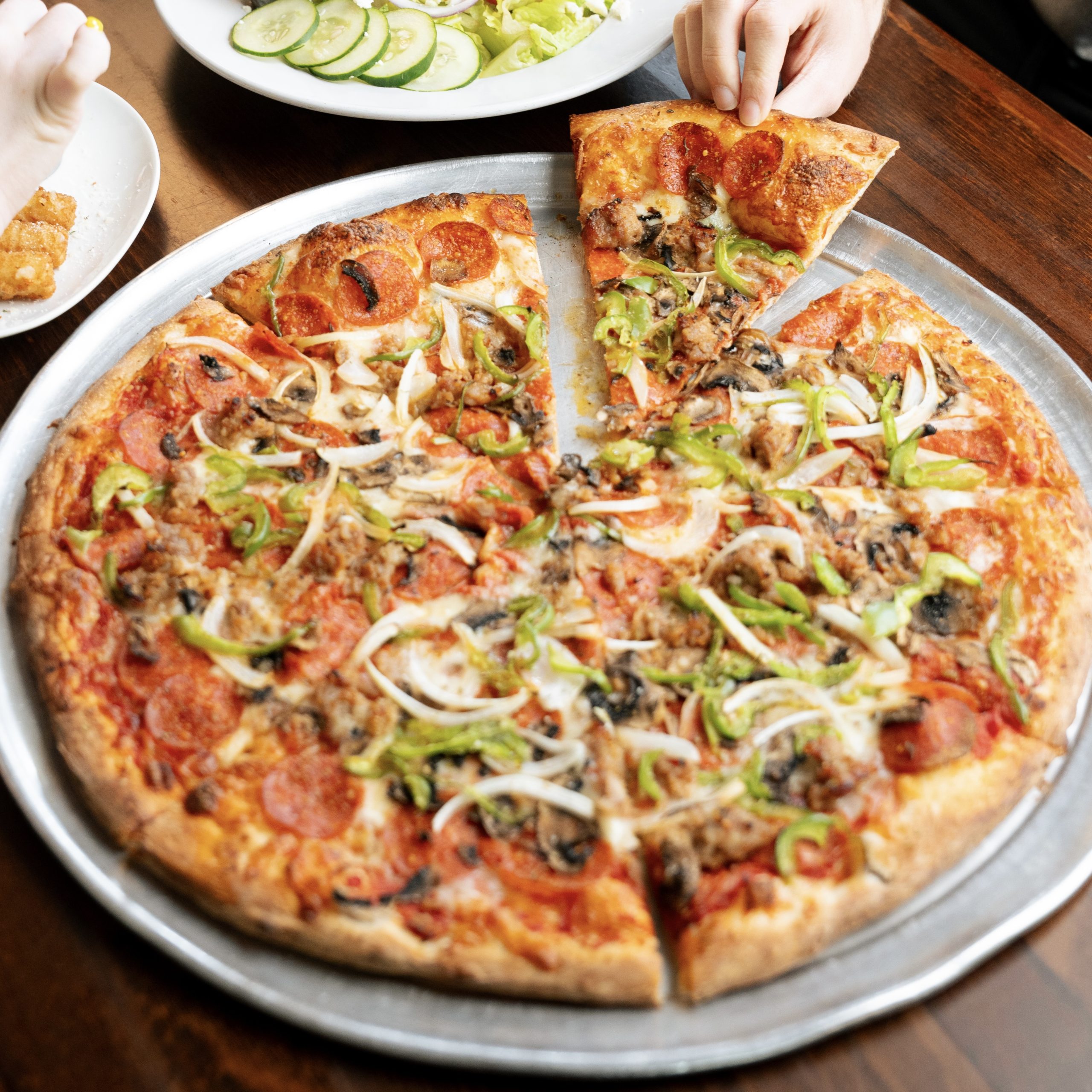 Highlighting deluxe summer pizza in Mount Pleasant
